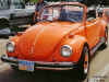 Oranje Volkswagen kever USA cabrio superbeetle