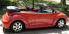 Oranje Volkswagen New Beetle cabriolet